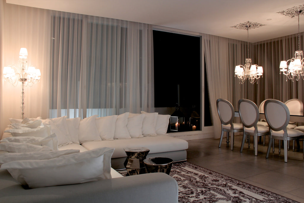 MEM Interiors Penthouse Interior Design - image of a living room and dining room with balcony